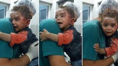 Garoto sírio ferido encontra conforto nos braços do enfermeiro