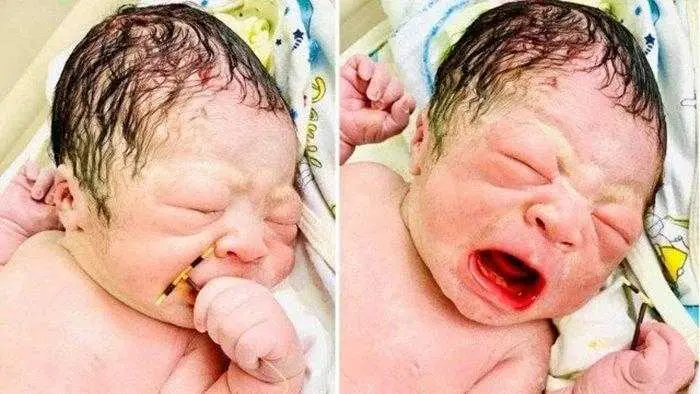 bebê chorando DIU mão